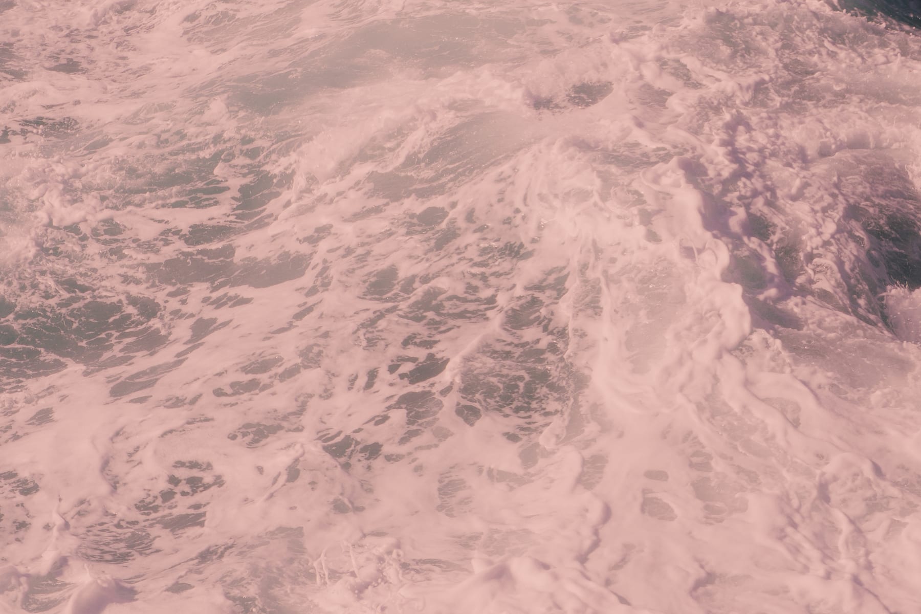 Foaming, swirling North Atlantic water seen from close up, Iceland.