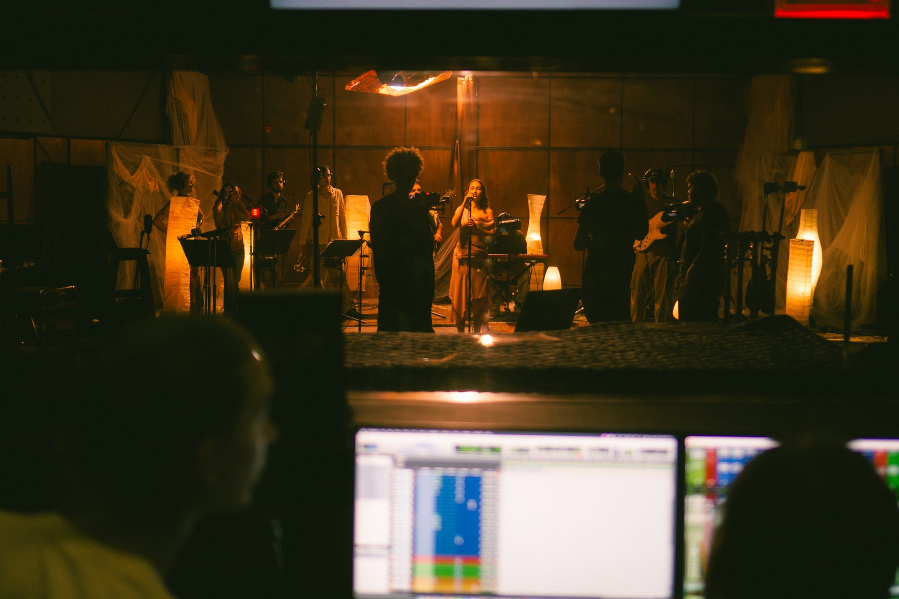 Pati Piko live session seen from the control room, the band behind the glass and a recording screen in front.
